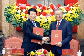 Party General Secretary and State President To Lam (R) and former State President Luong Cuong at the task handover ceremony on April 9. (Photo: VNA)