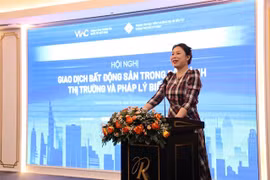 Ho Thi Quyen, deputy director of the HCM City Investment and Trade Promotion Centre, speaks at a conference titled ‘Real Estate Transactions in a Volatile Market and Legal Context’ in HCM City on August 28. Photo courtesy of ITPC)