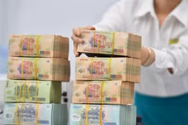The State Treasury has so far this year continued to expand the coordination of electronic bilateral collection and payment with 20 major commercial banks. (Photo: cafef.vn) 