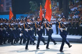 Coast guard officers march past the grandstand at the parade in HCM City on April 30. (Photo: VNA)