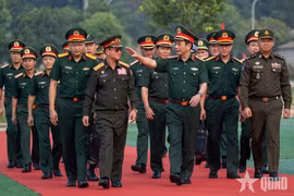 General Phan Van Giang, Politburo member, Deputy Secretary of the Central Military Commission, Deputy Prime Minister and Minister of National Defence of Vietnam; General Khamliang Outhakaysone, Deputy Prime Minister and Minister of National Defence of Laos; and General Tea Seiha, Deputy Prime Minister and Minister of National Defence of Cambodia attend the joint civil defence exercise in Hanoi on October 14, 2026. (Photo: qdnd.vn)