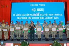 The insignia “For the cause of UN peacekeeping” is presented to 60 individuals. (Photo: VNA)