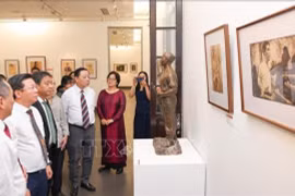 People visit the art exhibition to honour generations of contributors to national independence begins at the Vietnam Fine Arts Museum in Hanoi on August 15. (Photo: VNA)