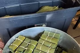 Banh Chung is the iconic square sticky rice cake that symbolises Tet (Photo: VNA)