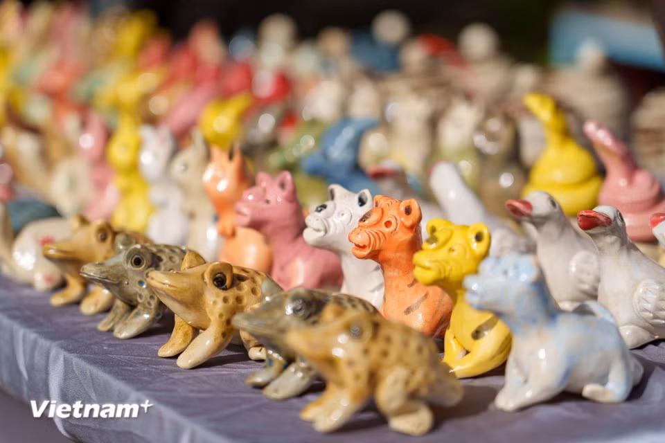 After firing, “to he” figurines are painted in vibrant colours. (Photo: Thanh Phong/Vietnam+)