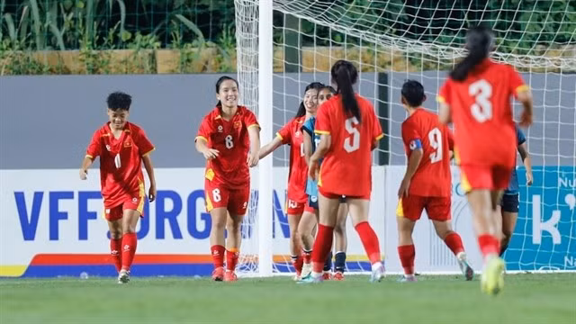 Vietnamese players celebrate after scoring in their 5-0 win over Singapore in their first match of the AFC U20 Women’s Asian Cup 2026 Qualifiers Group B ties on August 6 in Hanoi. (Photo: the-afc.com)