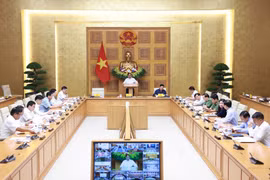 Prime Minister Pham Minh Chinh chairs a teleconference to review recovery efforts following the devastating impact of Typhoon Bualoi, and to prepare for the arrival of Typhoon Matmo. (Photo: VNA)