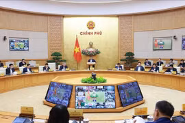 Prime Minister Pham Minh Chinh speaks at the regular Government meeting (Photo: VNA)