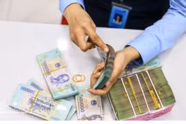 The daily reference exchange rate is set at 25,596 VND/USD on September 11. (Photo: VNA)