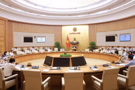 Prime Minister Pham Minh Chinh chairs the monthly Government law-making session on July 23. (Photo: VNA)