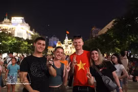 Foreign tourists celebrate Vietnam's National Day in Ho Chi Minh City. (Photo: VNA)
