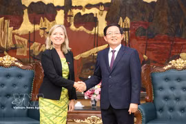 Deputy Prime Minister Ho Quoc Dung (R) receives Mariam Sherman, WB Division Director for Vietnam, Cambodia and Laos, in Hanoi on June 19. (Photo: VNA)