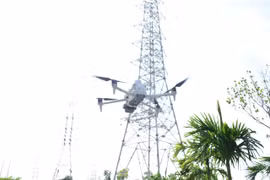 Unmanned aerial vehicle used to inspect power lines. (Photo: VNA) 