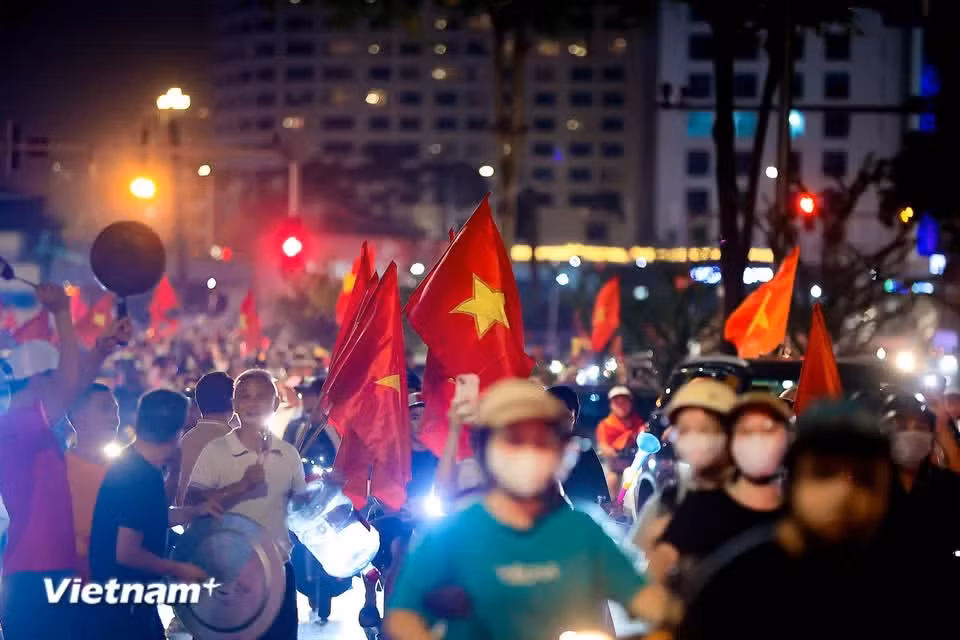 The Kim Lien underpass is awash in the red of the national flag. (Photo: VietnamPlus)