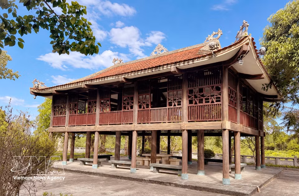 Amid the cemetery's tranquil memorial grounds stands a traditional stilt house of ethnic communities in Hoa Binh province. (Photo: VNA)