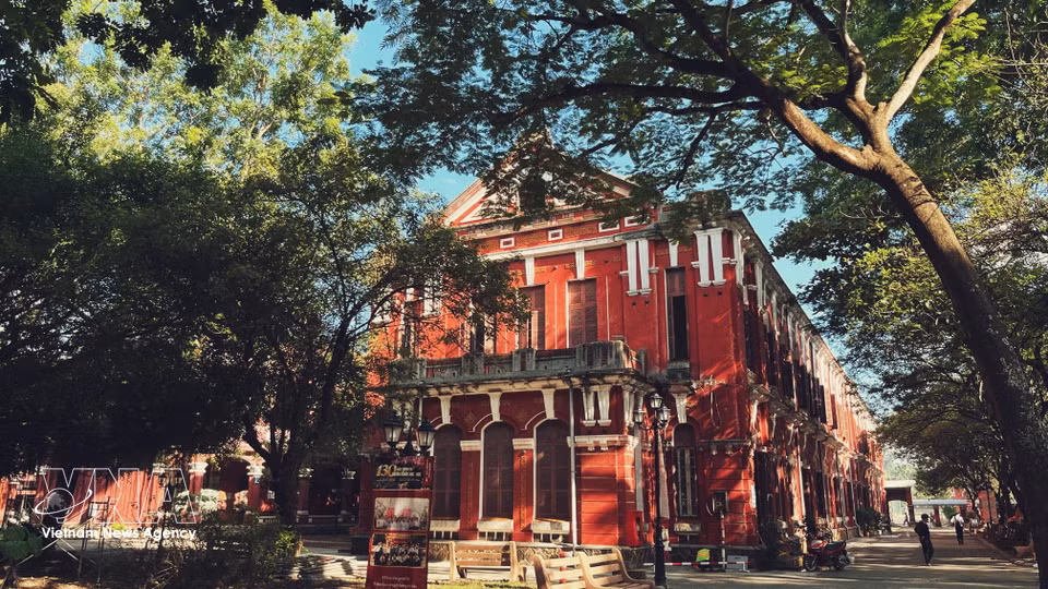 The school’s Indochinese architectural style with its red facades and arched openings. (Photo: Van Dung/VNA)