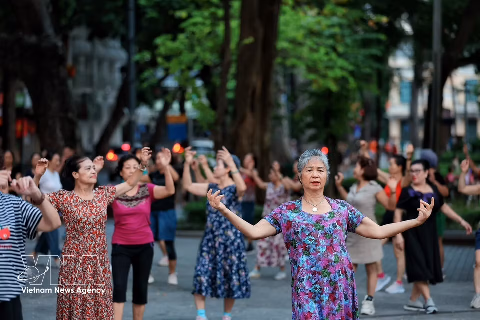 A group of older women practise exercises to maintain their fitness and wellbeing. (Photo: Pham Tuan Anh/VNA)