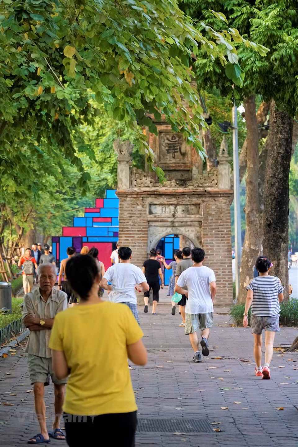 Hanoians often do exercise around the lake thanks to its greenery and fresh air (Photo: Vietnam+)