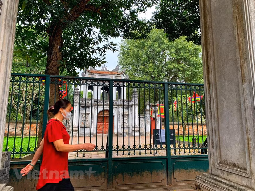 People have to give up their daily exercise around the Temple of Literature’s garden as it has closed to visitors amid coronavirus outbreak . Van Mieu is a temple dedicated to Confucius in Hanoi, northern Vietnam. The temple also hosts the Imperial Academy Vietnam's first national university. The temple was built in 1070 at the time of Emperor Ly Thanh Tong. It is one of several temples in Vietnam which is dedicated to Confucius, sages and scholars. The temple is located to the south of the Imperial Citadel of Thang Long. The various pavilions, halls, statues and steles of doctors are places where offering ceremonies, study sessions and the strict exams of the Dai Viet took place. (Photo: Mai Mai/ Vietnamplus)