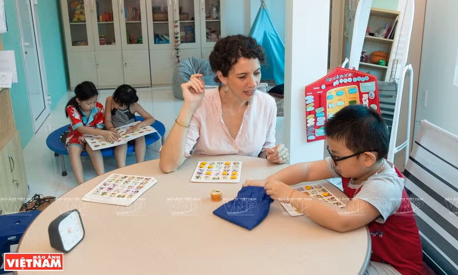 Anna Sophie, a language therapist, has helped foster language development among many children with autism in Hanoi. (Photo: VNP)