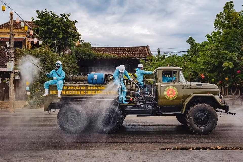 Spray disinfectant at the Hoi An ancient town