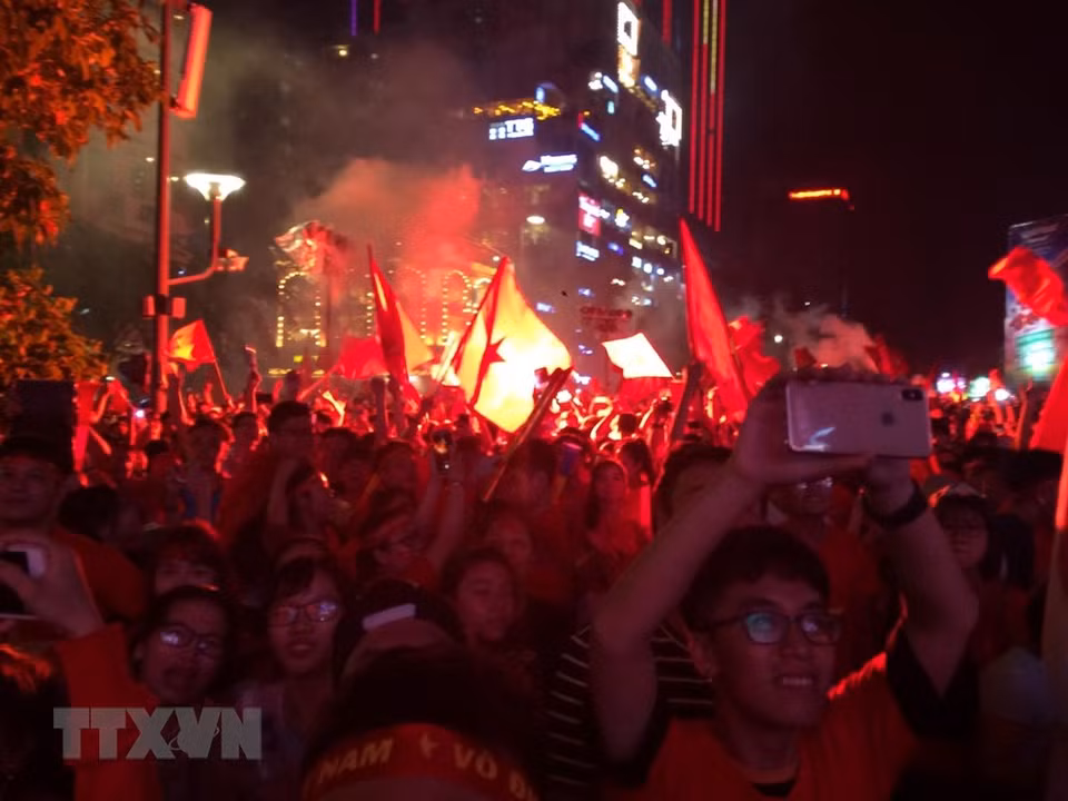 Fans in Ho Chi Minh City flock into streets to celebrate the win (Photo: VNA)