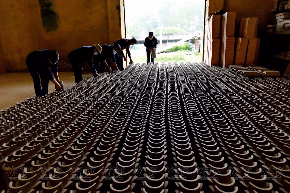 Different stages of royal brick and tile-making. (Photo: VNA)