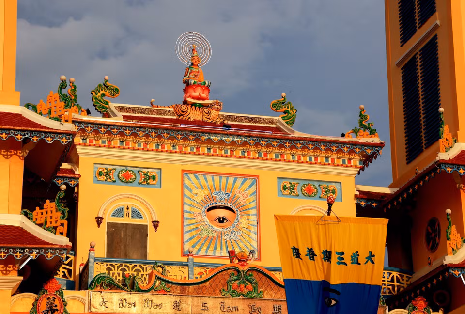 A Buddha on a Lotus Throne Statue and the Divine Eye at the front of the Tay Ninh Cao Dai Holy See. (Photo: VNA) 