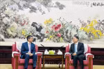 Vietnamese Ambassador to China Pham Thanh Binh (L) and President of the Chinese People’s Association for Friendship with Foreign Countries Yang Wanming. (Photo: VNA)
