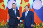 Prime Minister Pham Minh Chinh and his Lao counterpart Sonexay Siphandone in Hanoi on April 16. (Photo: VNA)