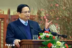 Prime Minister Pham Minh Chinh extends new year wishes to the banking sector at a meeting on February 3. (Photo: VNA)