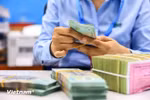 The economy's total credits reach over 15.6 quadrillion VND (610.3 billion USD) in 2024 (Photo: VNA)