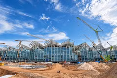 Around 9,500 unitised glass panels are being fitted to the Terminal T2 façade at Phu Quoc International Airport. (Photo: VietnamPlus) 