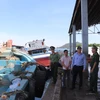 Vice Chairman of the Ho Chi Minh City People’s Committee Hoang Nguyen Dinh inspects IUU fishing prevention efforts at Hung Thai Port in Long Hai commune. (Photo: VNA)