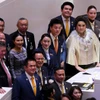 Prime Minister Paetongtarn Shinawatra (C) stands next to Opposition Leader Natthaphong Ruengpanyawut, who went to greet her after the premier survived Wednesday’s no-confidence motion. (Photo: Bangkok Post)
