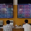 Investors conduct transactions at Bao Viet Securities' headquarters in Hanoi. (Photo: VNA)