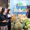 Visitors shop products at the Vietnam OCOP Festival 2025, which is one of key national trade promotion programmes. (Photo: VNA)