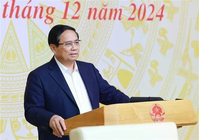 Prime Minister Pham Minh Chinh speaks at the national conference in Hanoi on December 25 on the implementation of the laws and resolutions passed by the 15th National Assembly (NA) at its eighth session. (Photo: VNA) pm.jpg