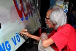 Painter of hand-colouring posters