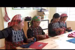 Ethnic people make fortune in brocade craft