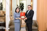 VNA Deputy General Director Doan Thi Tuyet Nhung (L) meets Chairman of the Board of Azerbaijan State News Agency (AZERTAC) Vugar Aliyev (Photo: VNA)