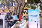 A Mongolian woman introduces her country and its people next to a banner announcing the plan for a direct flight from Ulaanbaatar to Ho Chi Minh City. (Photo: VNA)