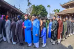 Artists, ambassadors bringing back “ao dai” for men