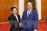 PM Nguyen Xuan Phuc pledges continuous support for Laos’s nation building