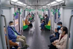 Passengers on the Nhon-Hanoi Station metro line. Photo: VNA)