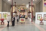 Vibrant flowers join steel figures in exhibition