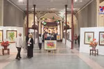 Vibrant flowers join steel figures in exhibition 