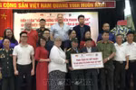 War evidence records of Vietnamese soldiers who laid down their lives or were missing in the resistance war against the US imperialists are handed over to their families at a ceremony in Hanoi. (Photo: VNA)
