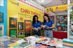 Visitors to an exhibition booth of the Thanh Nien Publishing House. (Photo: VNA)