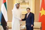 Prime Minister Pham Minh Chinh (R) hosts a reception for UAE Minister of Economy Abdulla Bin Touq Al Marri in Abu Dhabi on October 28. (Photo: VNA)